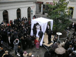 The Jewish wedding is performed under the "huppa" usually in an open ceremony.
