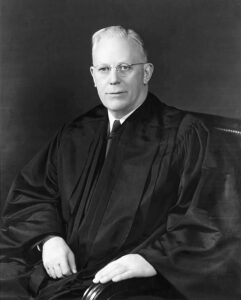 Earl Warren was the Chief Justice of the Supreme Court which ruled against school prayer.