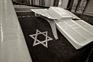 The Torah is the first five books of the Christian Bible describing Jewish Law and customs.